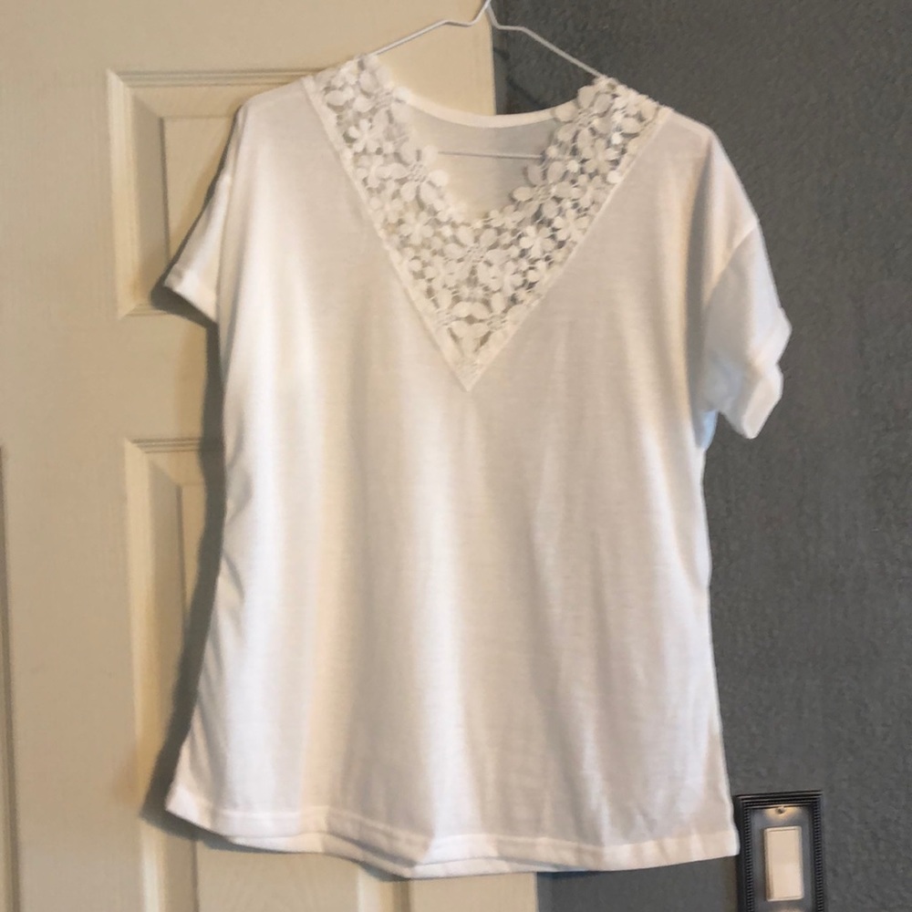 White shirt with lace neckline.